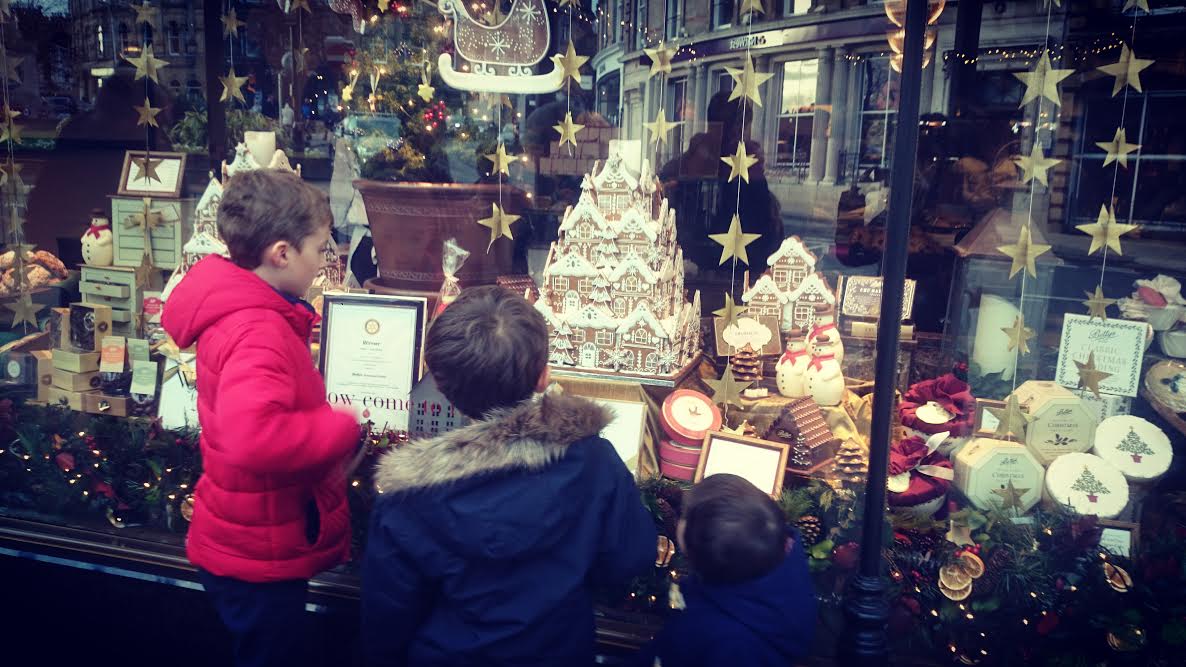 Madeline's children admire the Bettys Christmas window