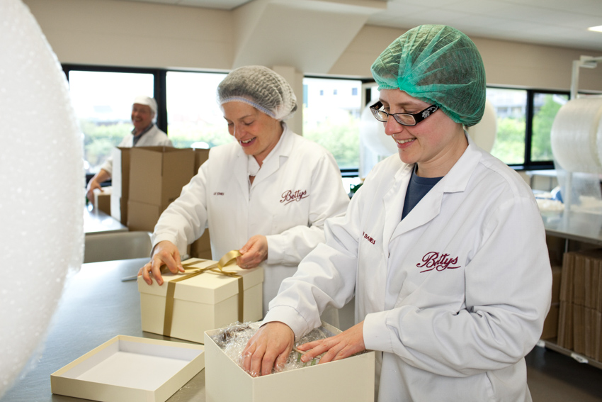 Sarah Bryson (right) carefully packs another delivery from Bettys