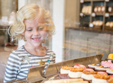 Choosing a treat from the fancy counter